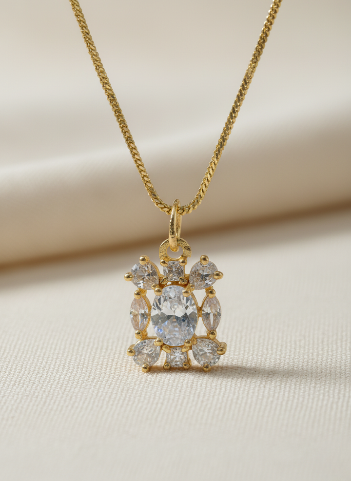 Ratmanee Royal Spark Pendant – Gold Necklace with Oval-Cut Crystal Center