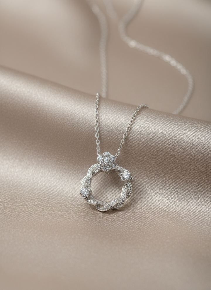 Ratmanee Silver Radiance Pendant – Twisted Circle Necklace with Sparkling Crystals